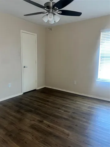 a backyard of a house with shaded area