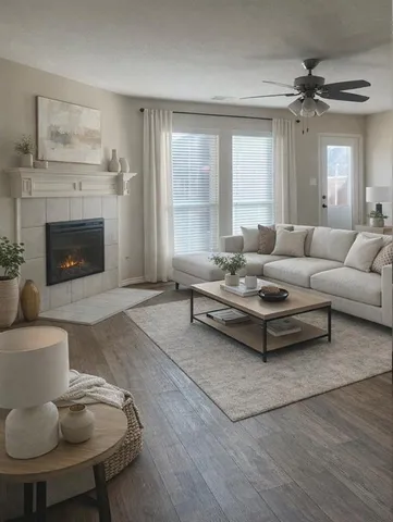 a living room with furniture and a fireplace