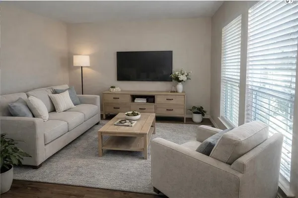 a living room with furniture and a flat screen tv