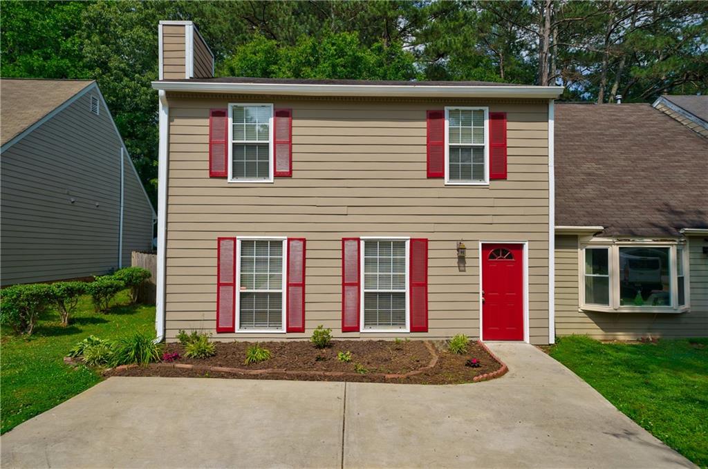 574 Manning Road Southwest Marietta, GA 30064 - Photo 1 of 1 a view of a house with a yard and large tree