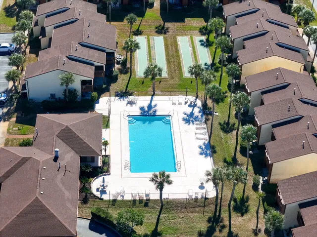 an aerial view of multiple houses with outdoor space