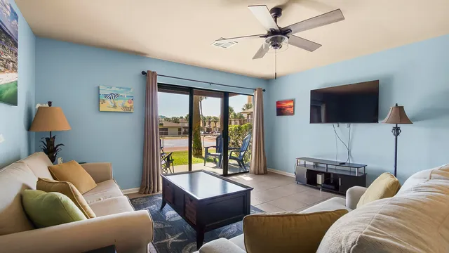 a dining room with furniture and chandelier