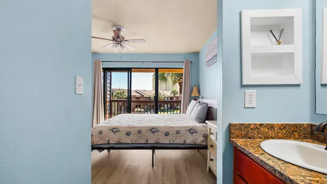 a bedroom with a large bed and a large window