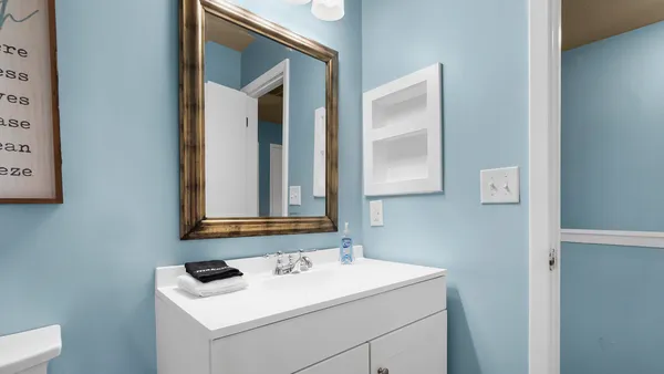 a bathroom with a shower and a sink