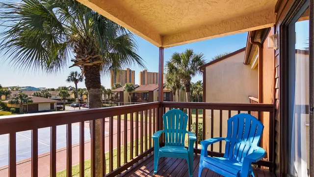 a view of a chairs and table in the patio
