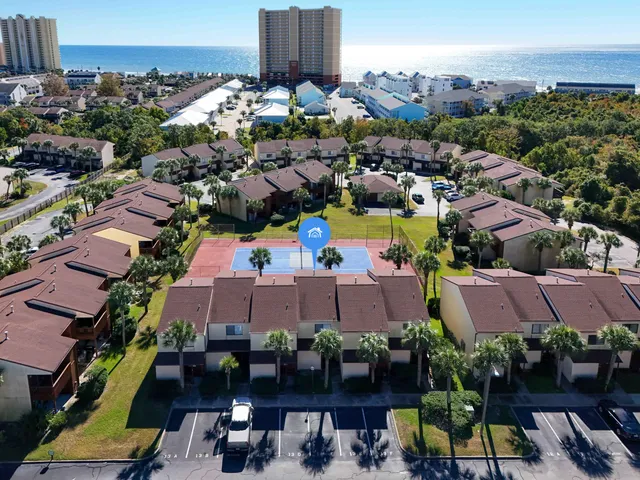 an aerial view of a houses and an outdoor space