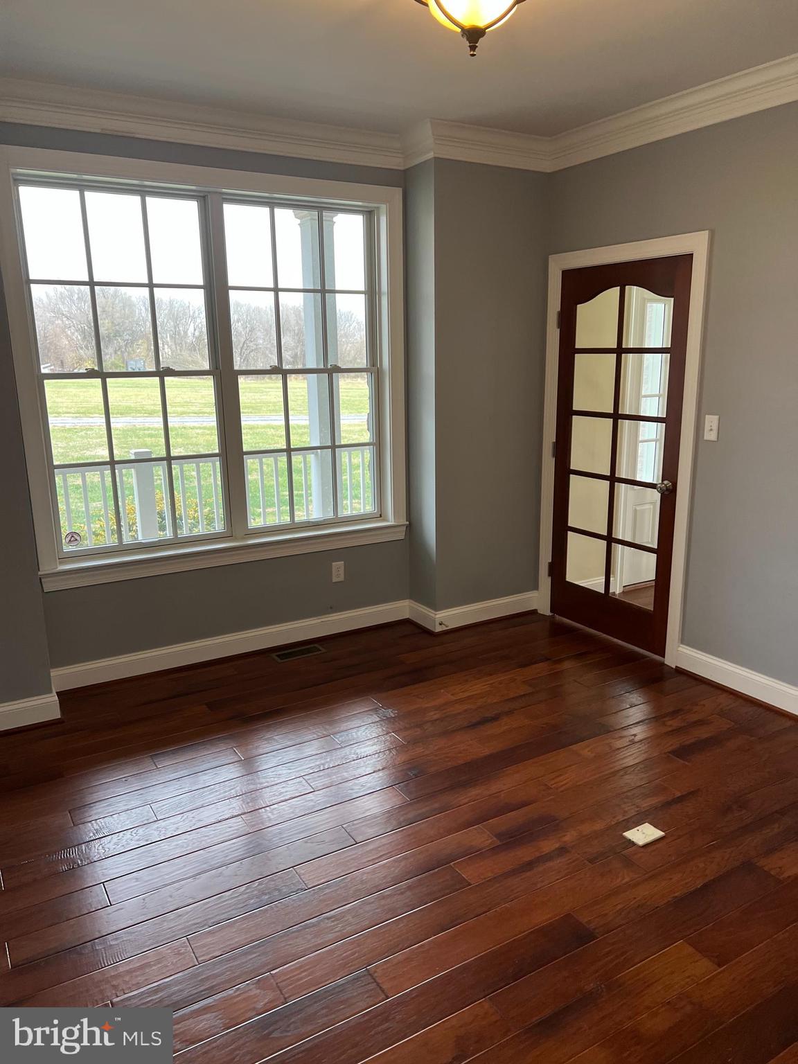 3913 Cap Stine Road Frederick, MD 21703 - Photo 8 of 19 wooden floor in an empty room with a window