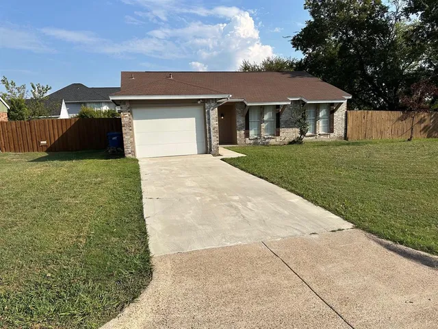 front view of a house and a yard