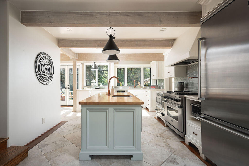 840 Ivy Lane Montecito, CA 93108 - Photo 27 of 57 a kitchen with stainless steel appliances granite countertop a stove and a refrigerator