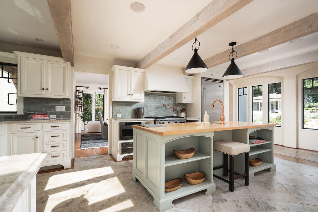 840 Ivy Lane Montecito, CA 93108 - Photo 31 of 57 a kitchen with a stove a sink and a refrigerator
