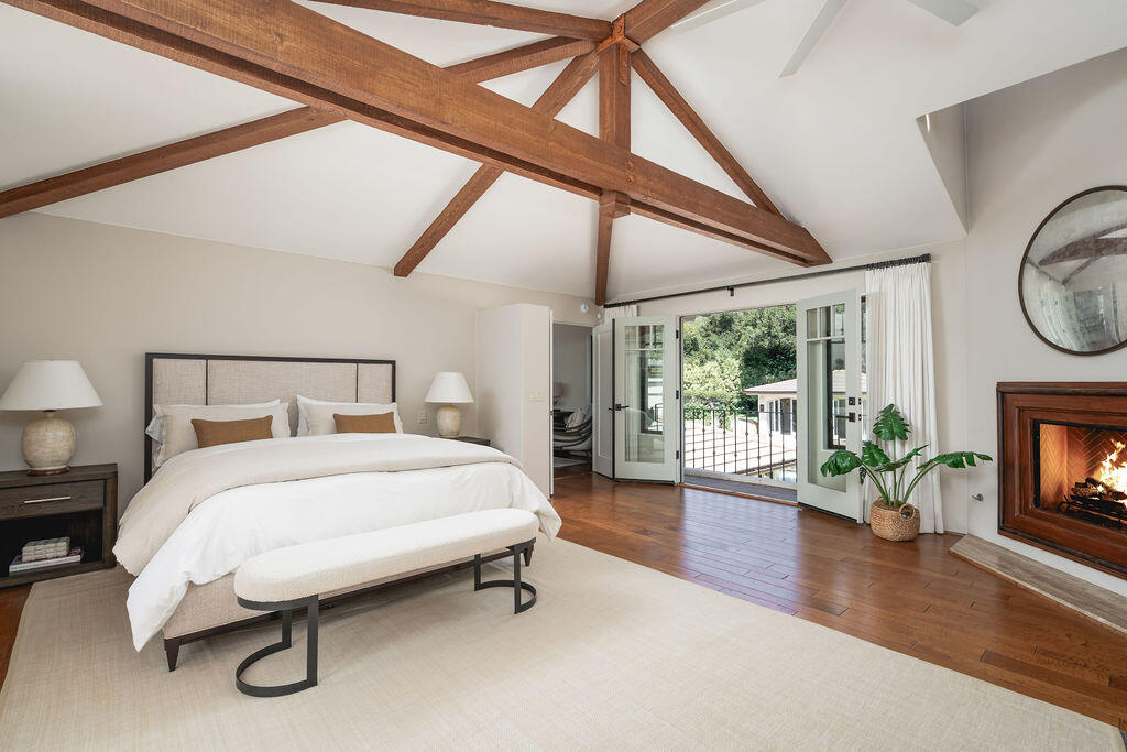 840 Ivy Lane Montecito, CA 93108 - Photo 38 of 57 a bedroom with a bed and a fireplace