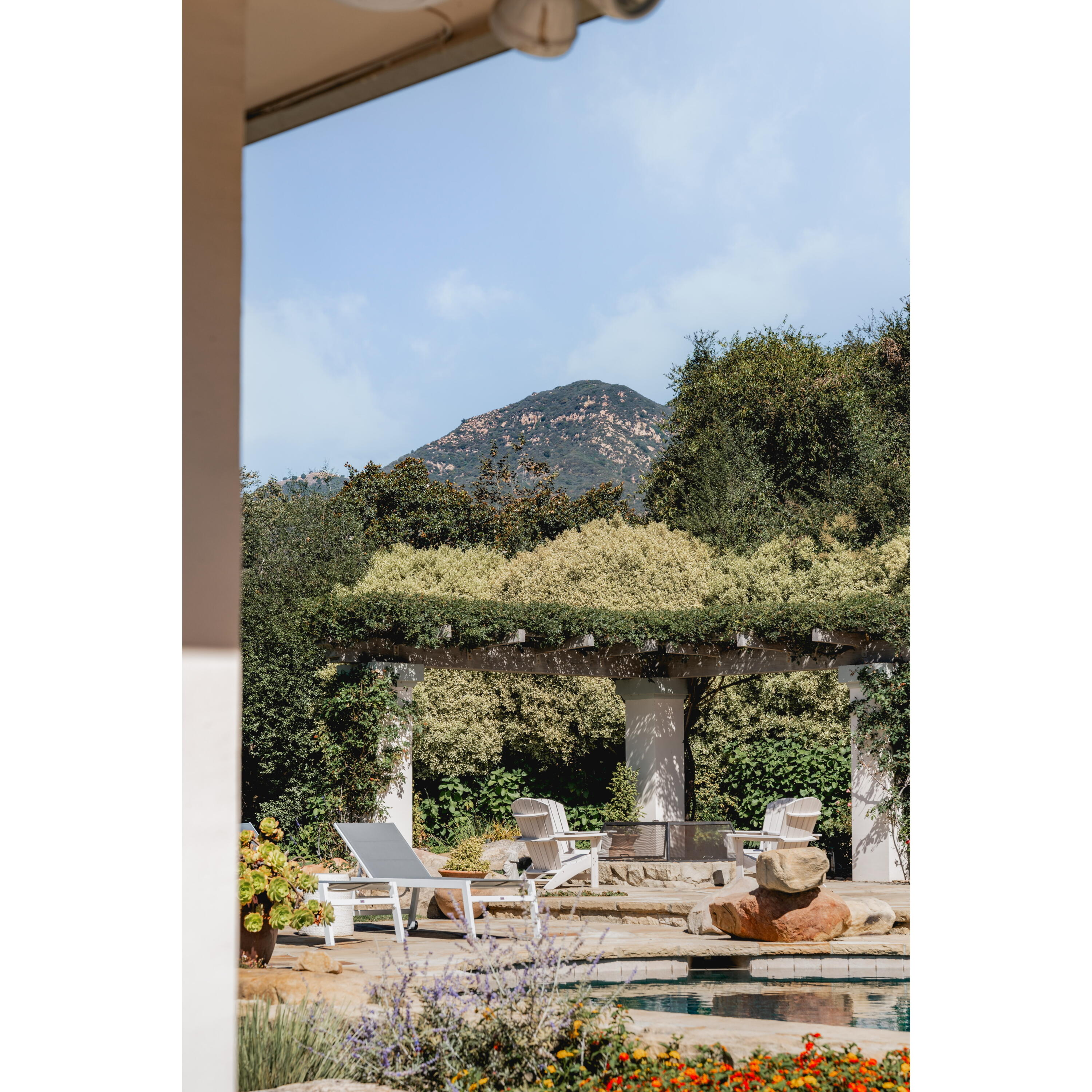 840 Ivy Lane Montecito, CA 93108 - Photo 50 of 57 a view of a living room with a floor to ceiling window and tree