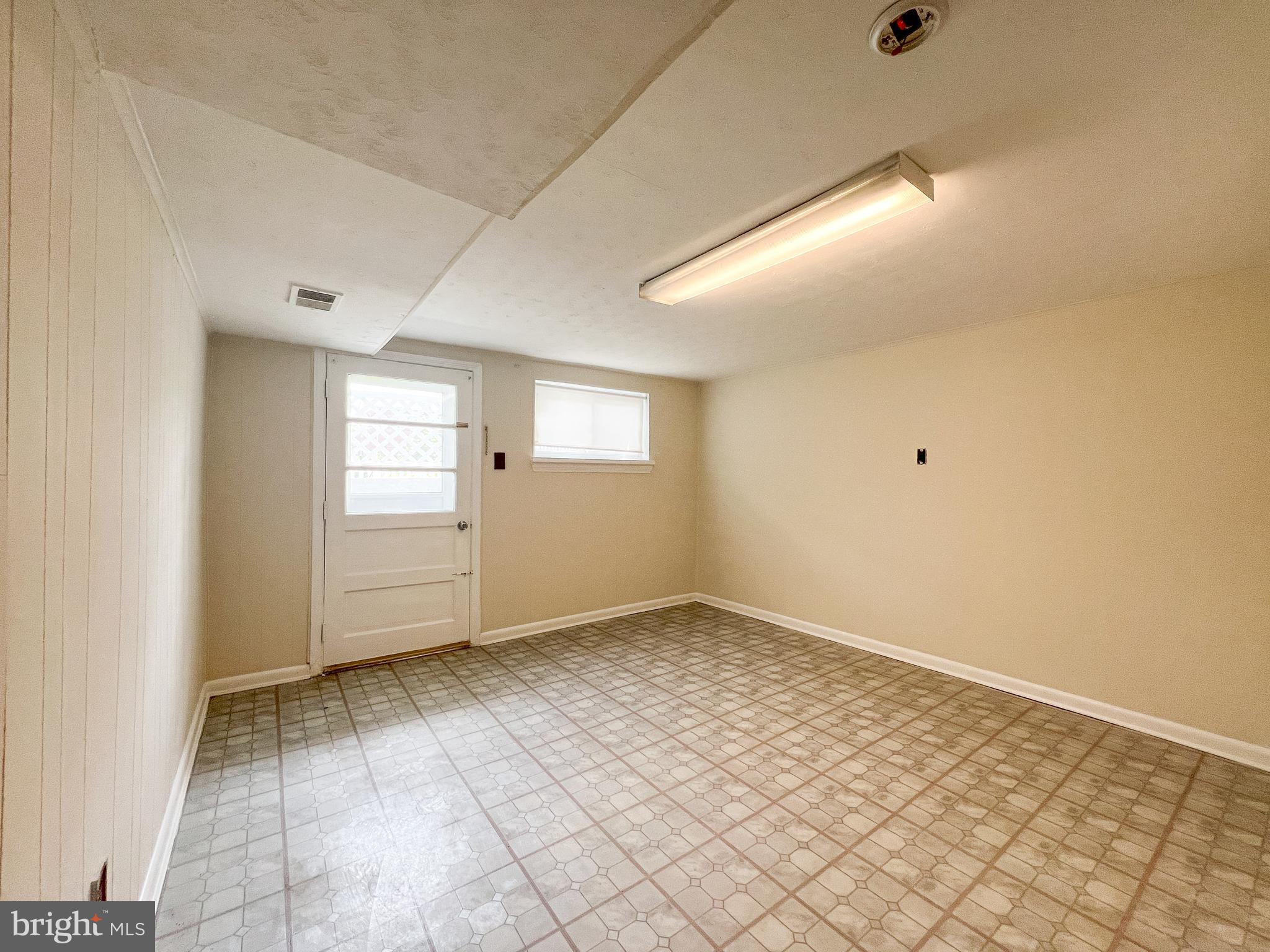 10209 Douglas Avenue Silver Spring, MD 20902 - Photo 14 of 22 a view of an empty room and window