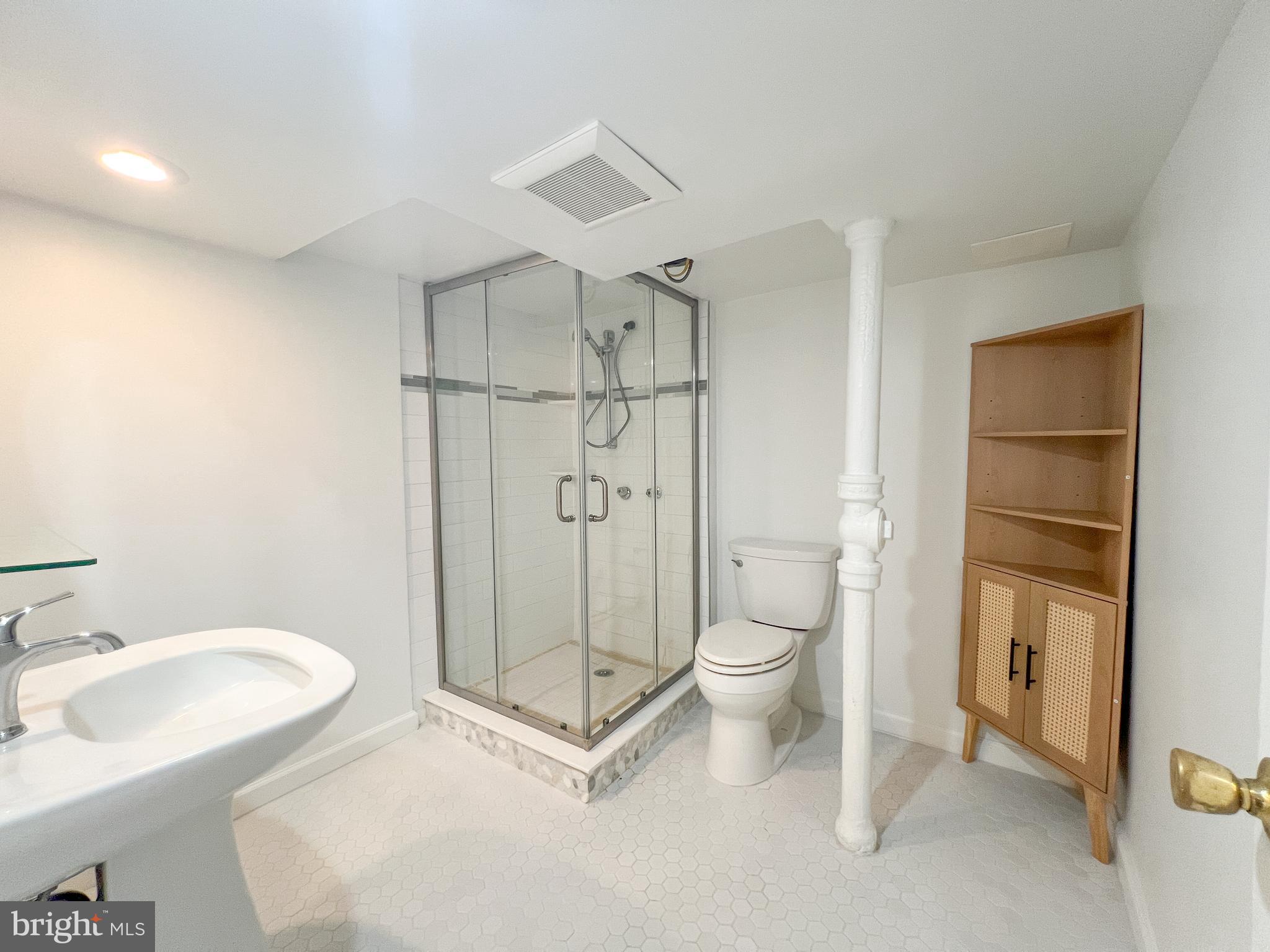 10209 Douglas Avenue Silver Spring, MD 20902 - Photo 15 of 22 a bathroom with a sink toilet and shower