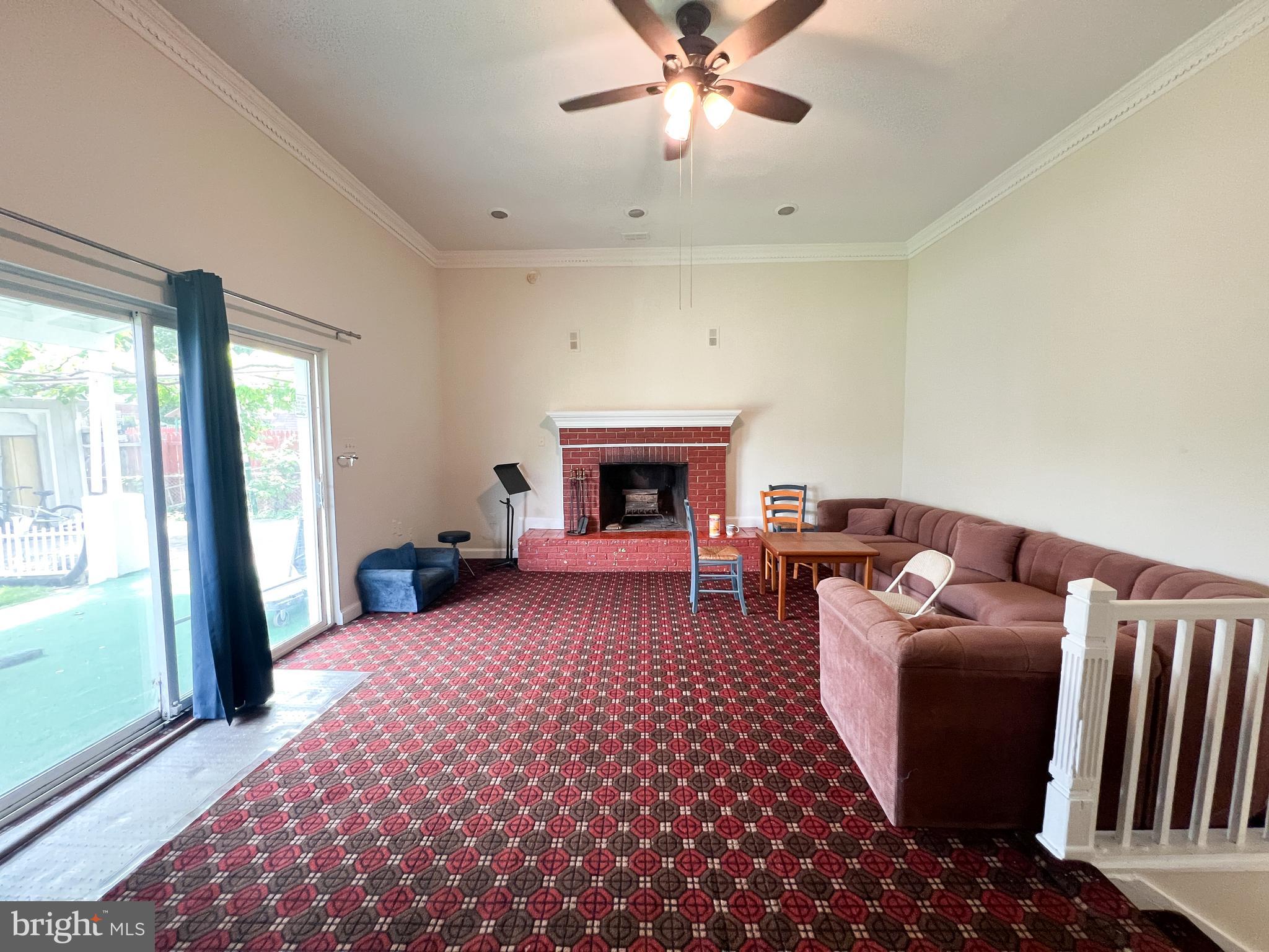 10209 Douglas Avenue Silver Spring, MD 20902 - Photo 2 of 22 a living room with furniture and a fireplace