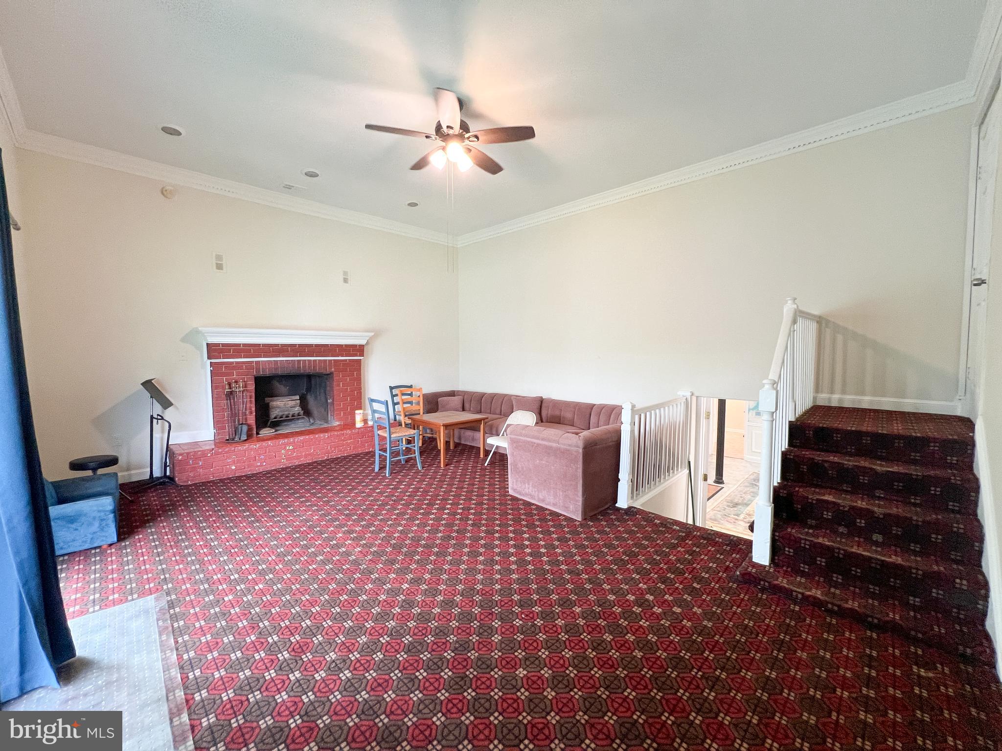 10209 Douglas Avenue Silver Spring, MD 20902 - Photo 3 of 22 a living room with furniture and a fireplace