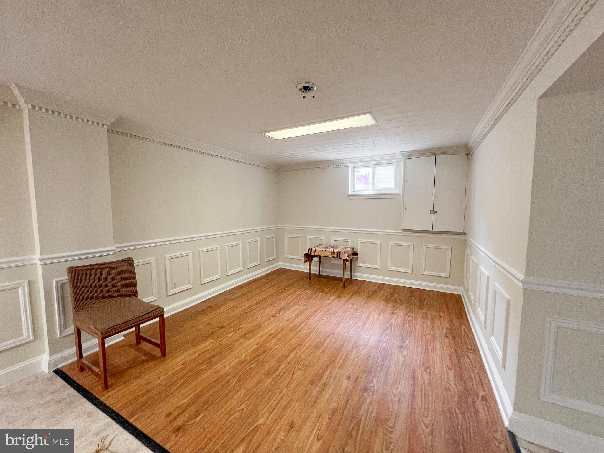 10209 Douglas Avenue Silver Spring, MD 20902 - Photo 6 of 22 a room with wooden floor and furniture