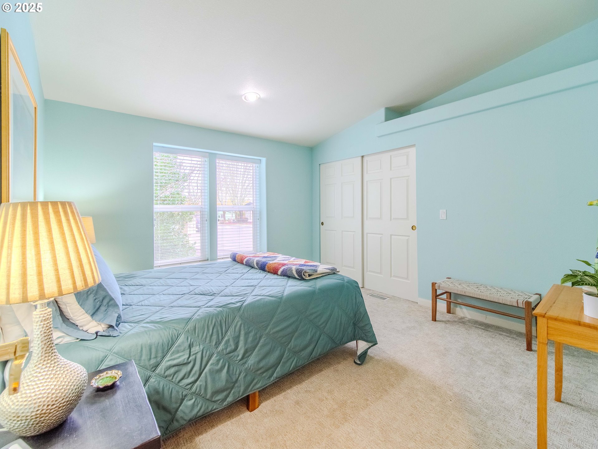 17572 Northwest Shady Fir Loop, Unit 24 Beaverton, OR 97006 - Photo 14 of 31 a bedroom with a bed and a window