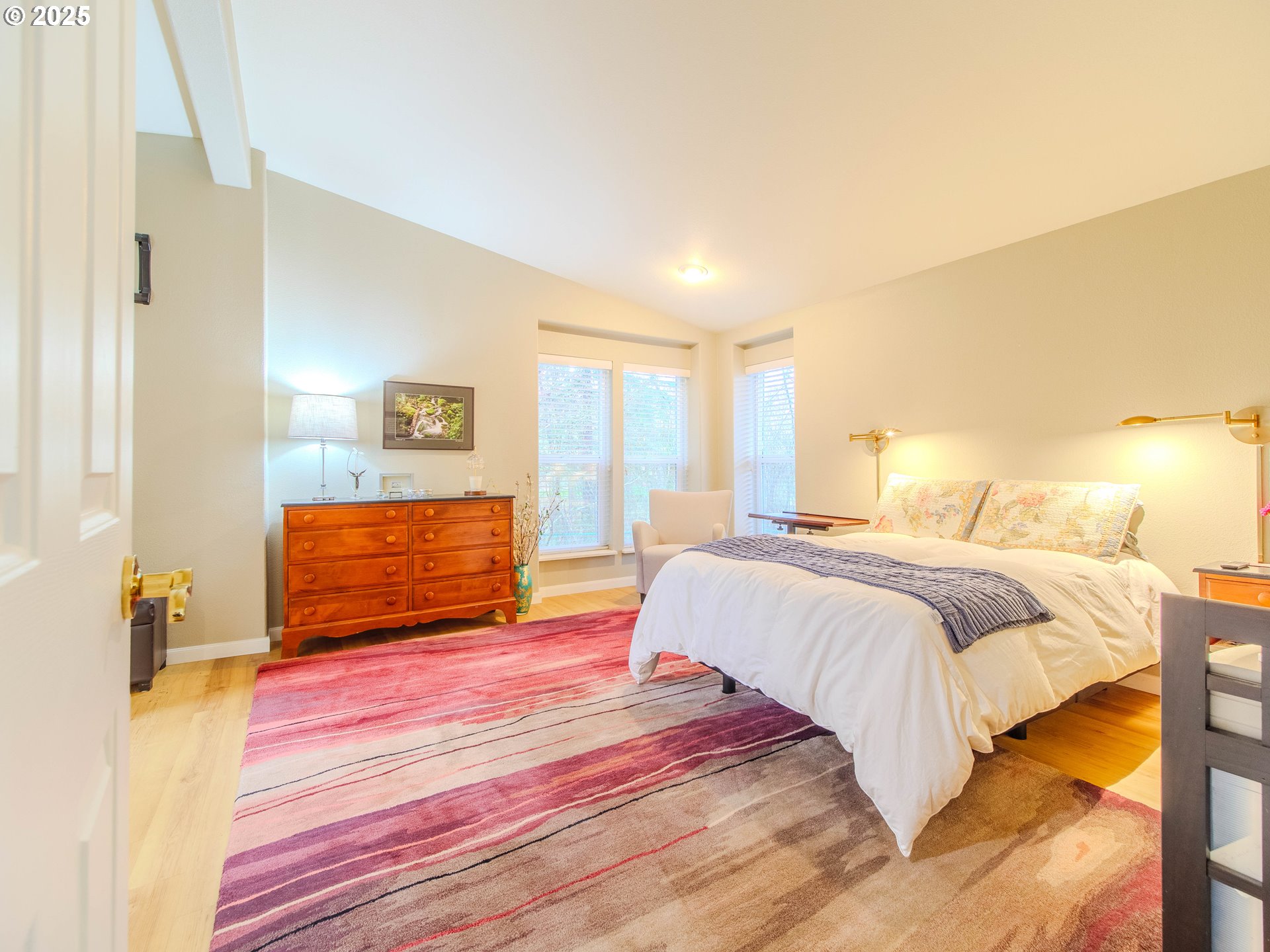 17572 Northwest Shady Fir Loop, Unit 24 Beaverton, OR 97006 - Photo 15 of 31 a bedroom with a bed and a lamp on dresser