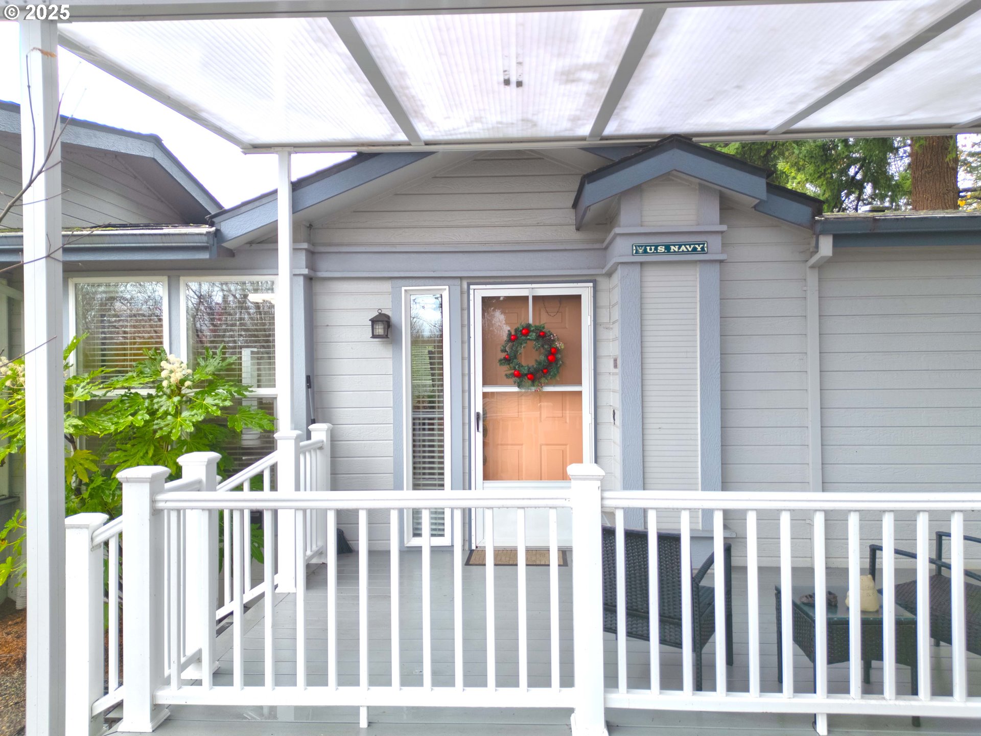 17572 Northwest Shady Fir Loop, Unit 24 Beaverton, OR 97006 - Photo 2 of 31 a view of a house with a small yard and wooden floor