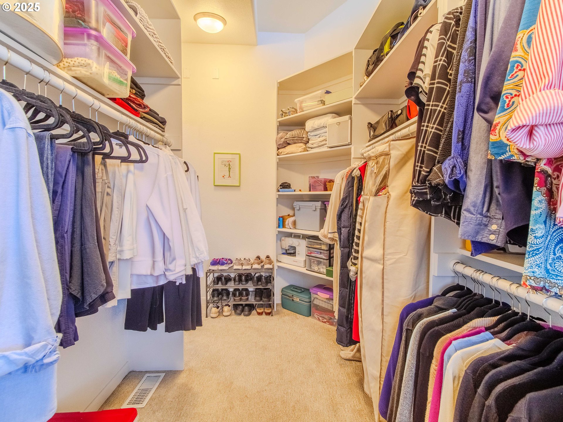 17572 Northwest Shady Fir Loop, Unit 24 Beaverton, OR 97006 - Photo 21 of 31 a view of walk in closet with clothes and shoes