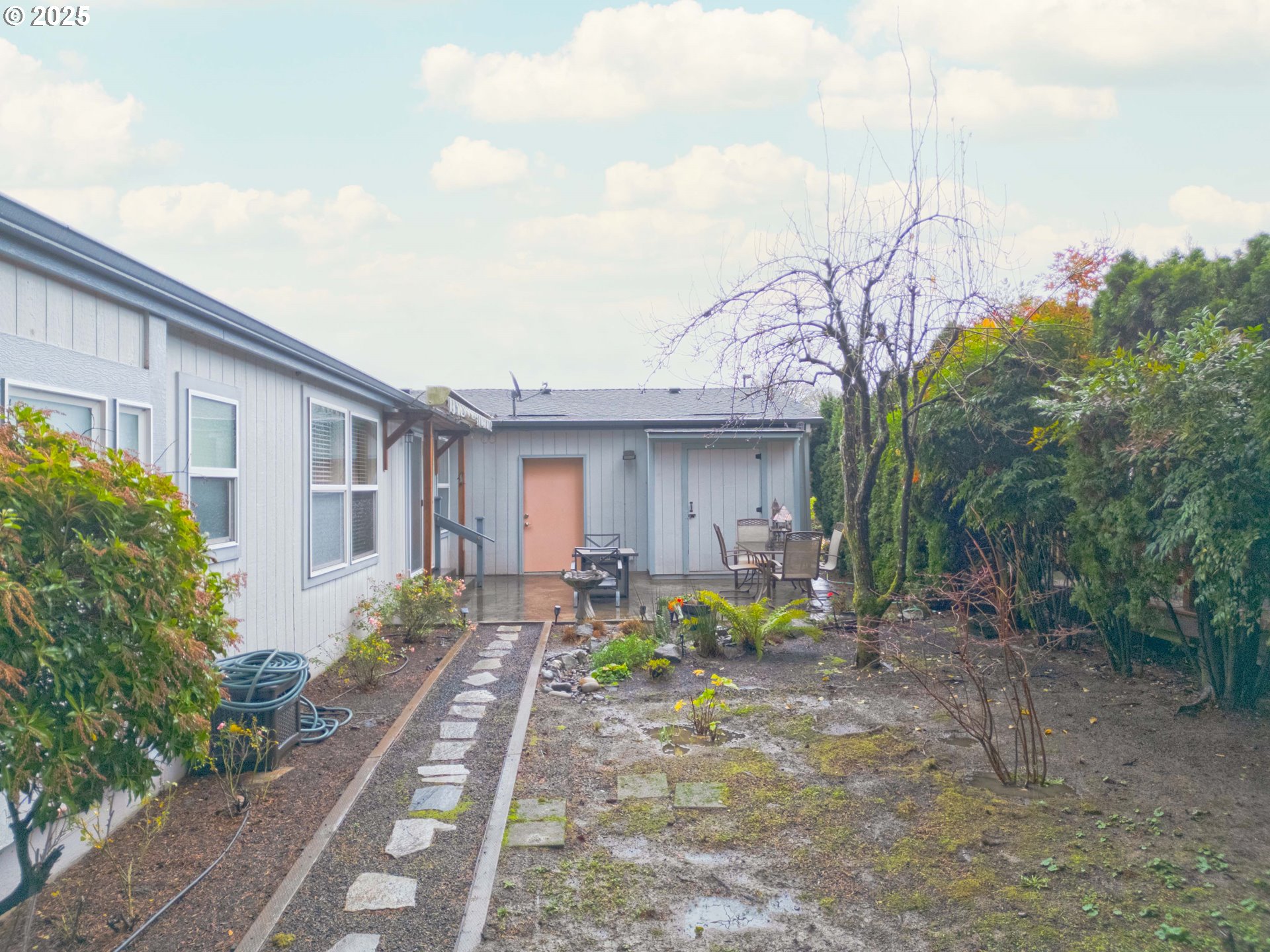 17572 Northwest Shady Fir Loop, Unit 24 Beaverton, OR 97006 - Photo 23 of 31 a front view of a house with garden