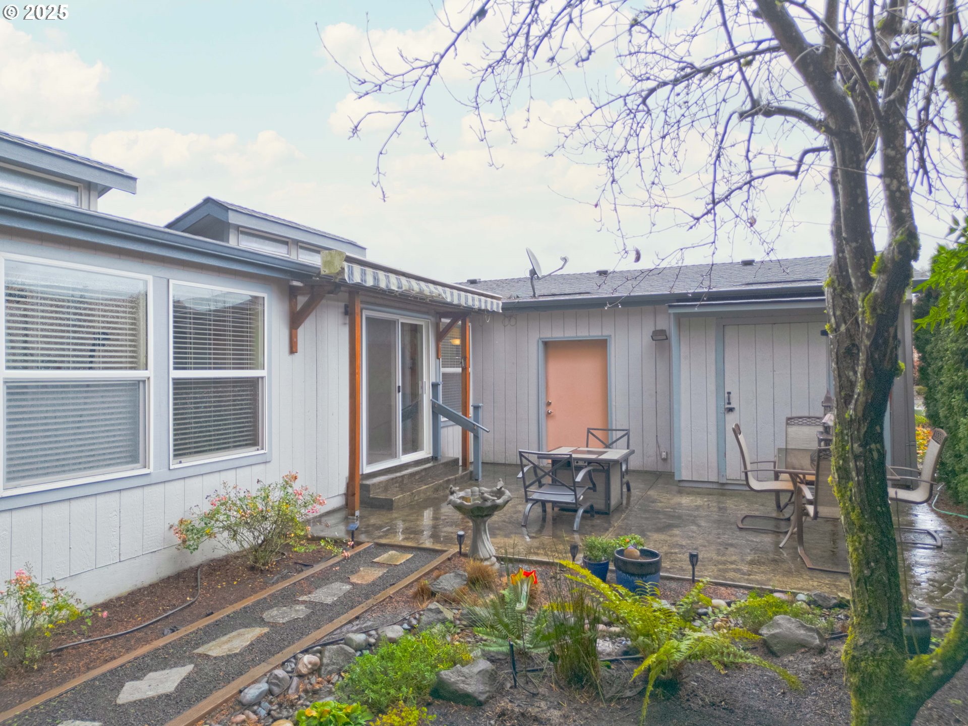 17572 Northwest Shady Fir Loop, Unit 24 Beaverton, OR 97006 - Photo 24 of 31 a front view of house with yard outdoor seating and green space