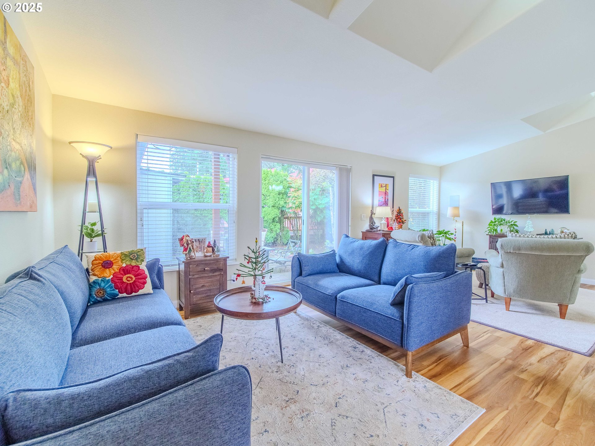 17572 Northwest Shady Fir Loop, Unit 24 Beaverton, OR 97006 - Photo 6 of 31 a living room with furniture and a large window