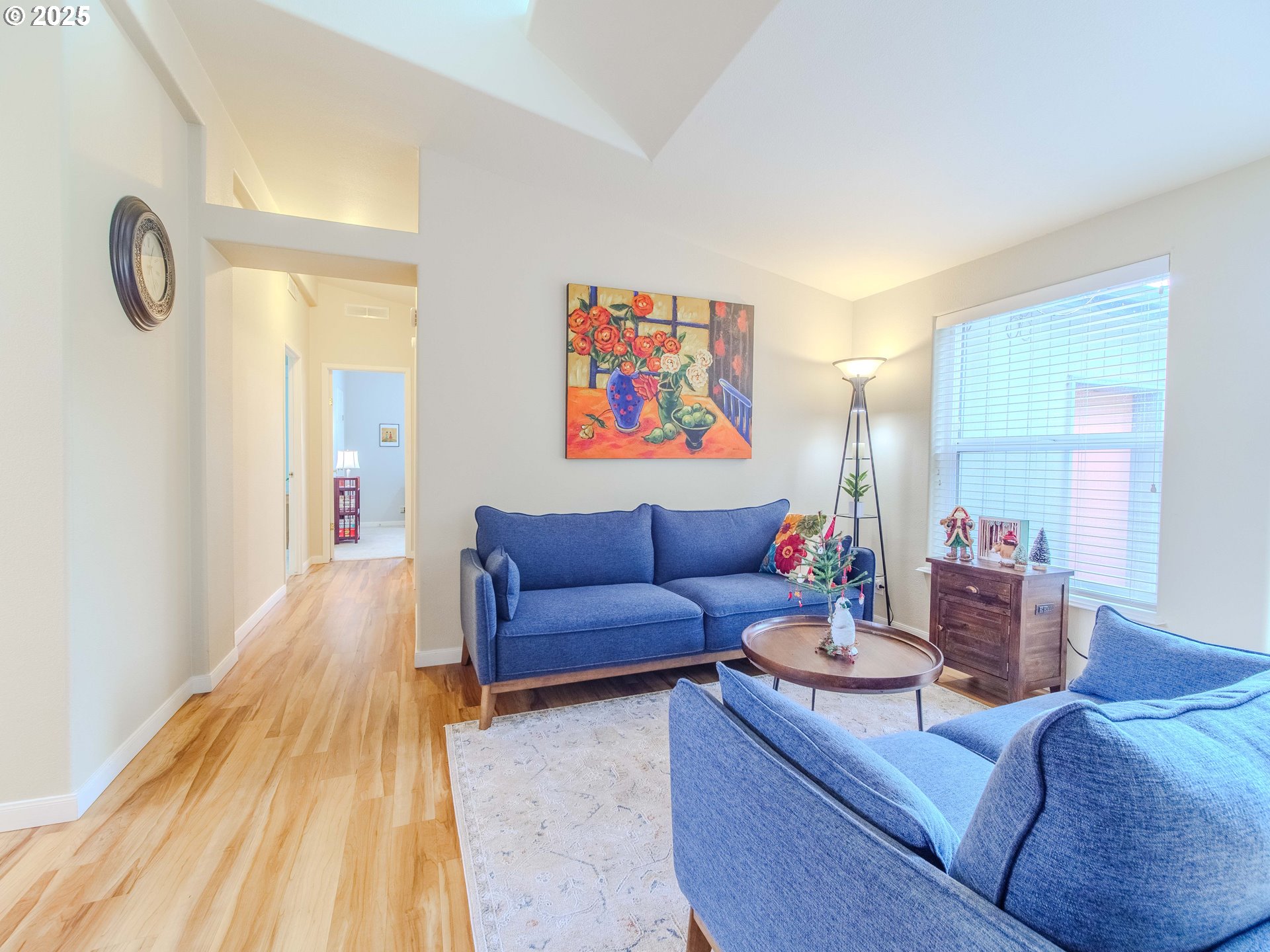 17572 Northwest Shady Fir Loop, Unit 24 Beaverton, OR 97006 - Photo 7 of 31 a living room with furniture and a wooden floor