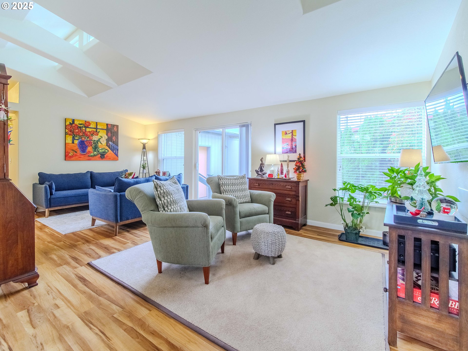 17572 Northwest Shady Fir Loop, Unit 24 Beaverton, OR 97006 - Photo 8 of 31 a living room with furniture and a potted plant