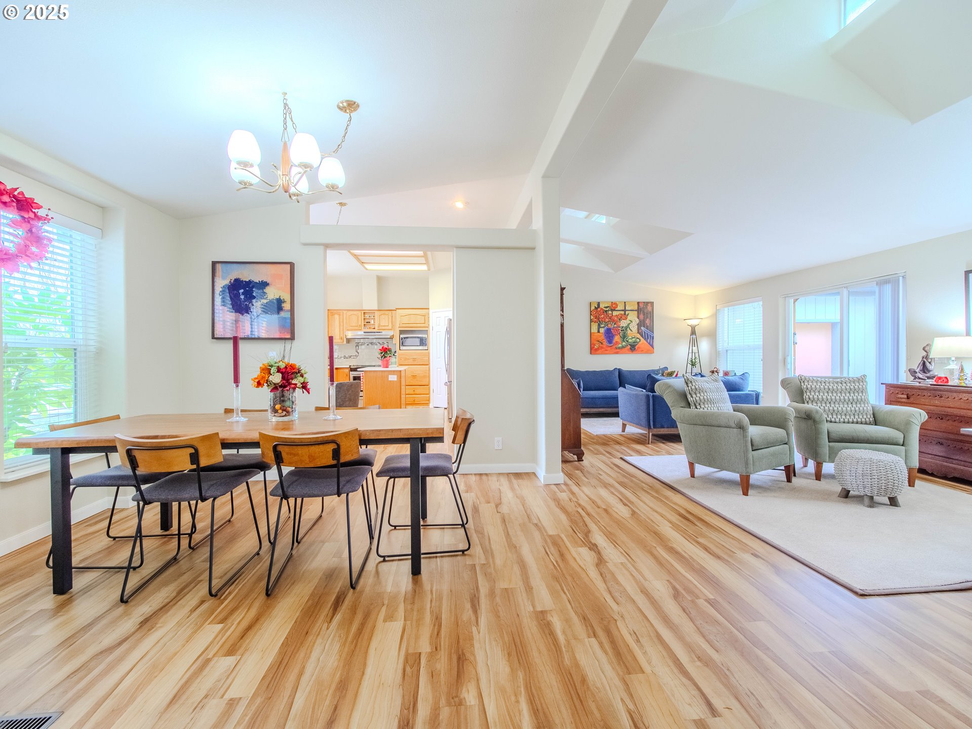 17572 Northwest Shady Fir Loop, Unit 24 Beaverton, OR 97006 - Photo 9 of 31 a living room with dining room and wooden floor