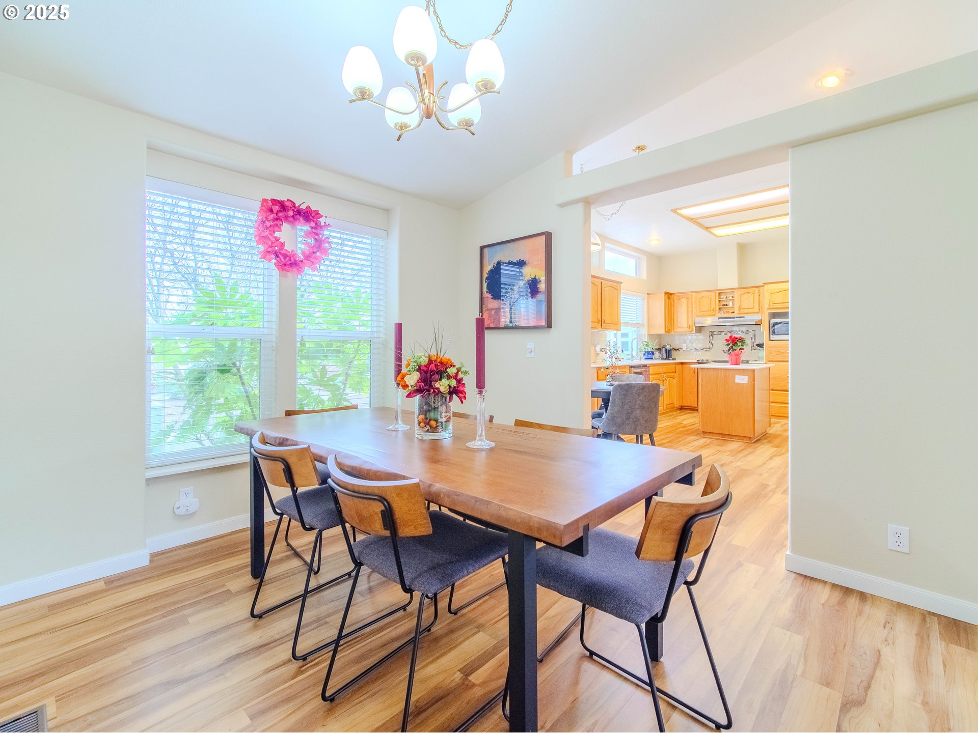 17572 Northwest Shady Fir Loop, Unit 24 Beaverton, OR 97006 - Photo 10 of 31 a view of a dining room with furniture window and wooden floor