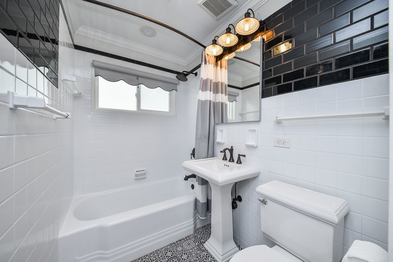 1845 Howard Street Wheaton, IL 60187 - Photo 24 of 29 a bathroom with a sink toilet and shower