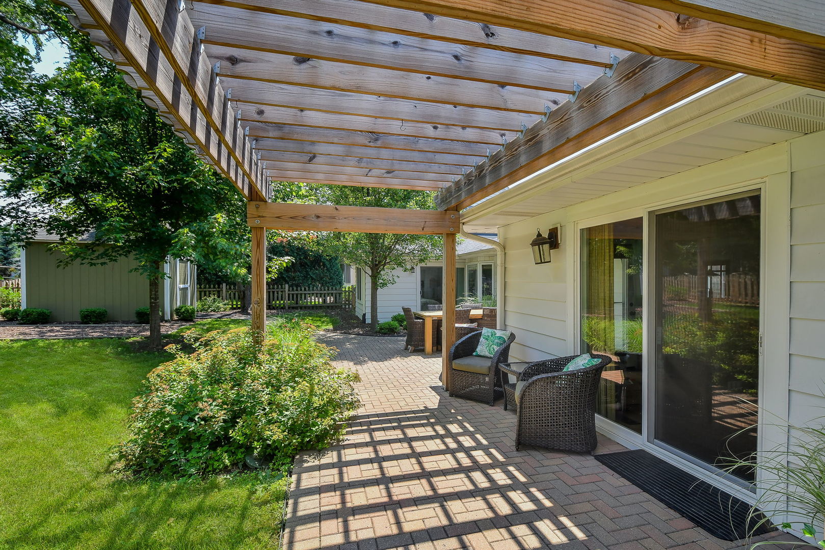 1845 Howard Street Wheaton, IL 60187 - Photo 26 of 29 a view of a patio with table and chairs barbeque potted plants and floor to ceiling window