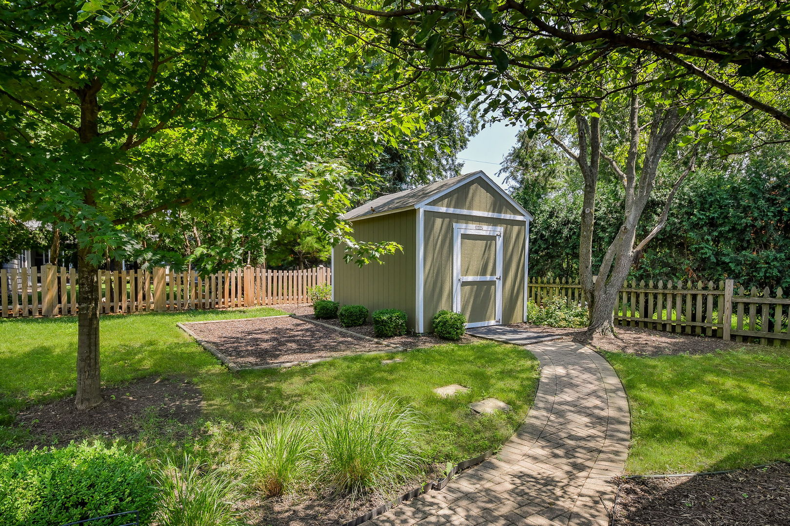 1845 Howard Street Wheaton, IL 60187 - Photo 27 of 29 a front view of a house with garden