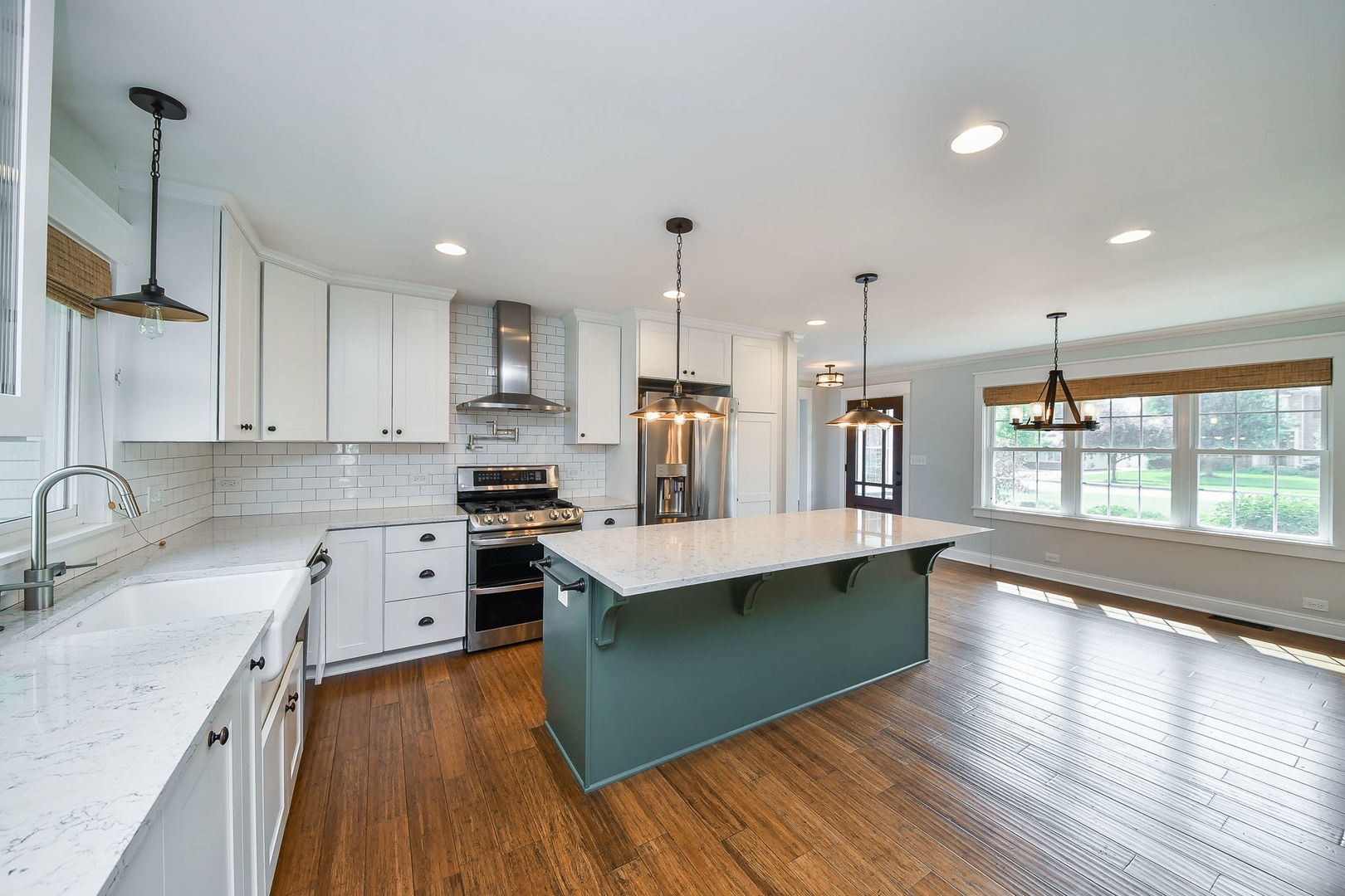 1845 Howard Street Wheaton, IL 60187 - Photo 3 of 29 a kitchen with stainless steel appliances granite countertop a sink stove and refrigerator
