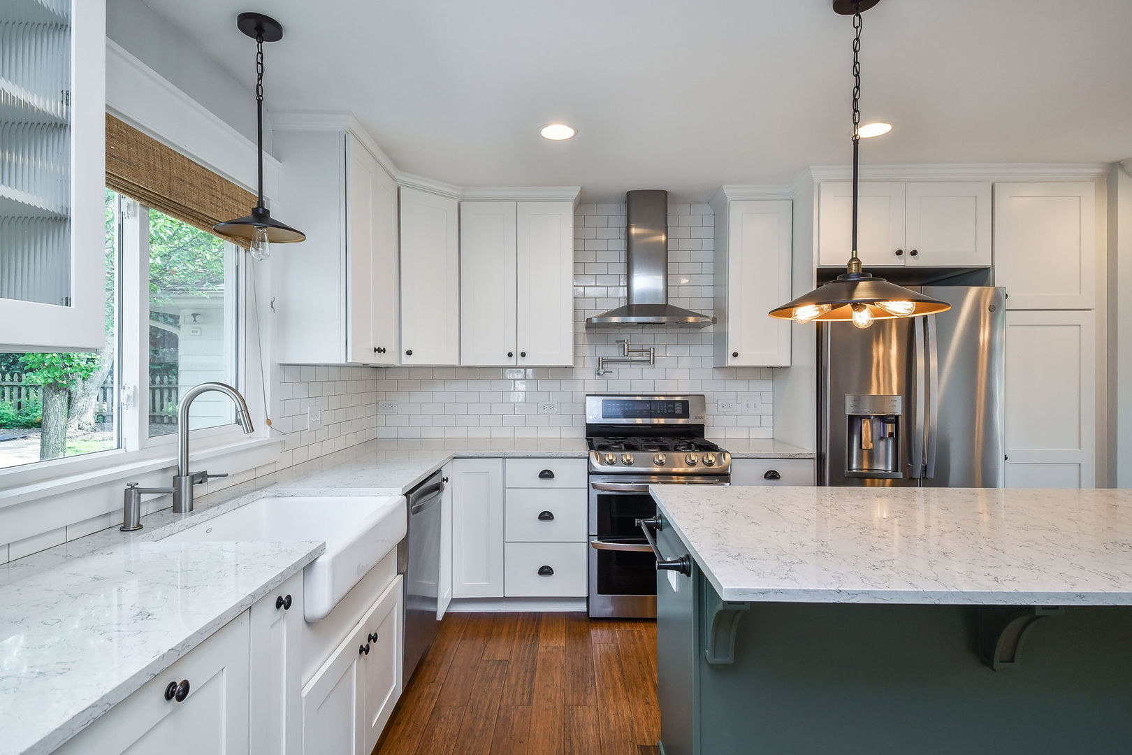 1845 Howard Street Wheaton, IL 60187 - Photo 5 of 29 a kitchen with stainless steel appliances granite countertop a sink stove and refrigerator