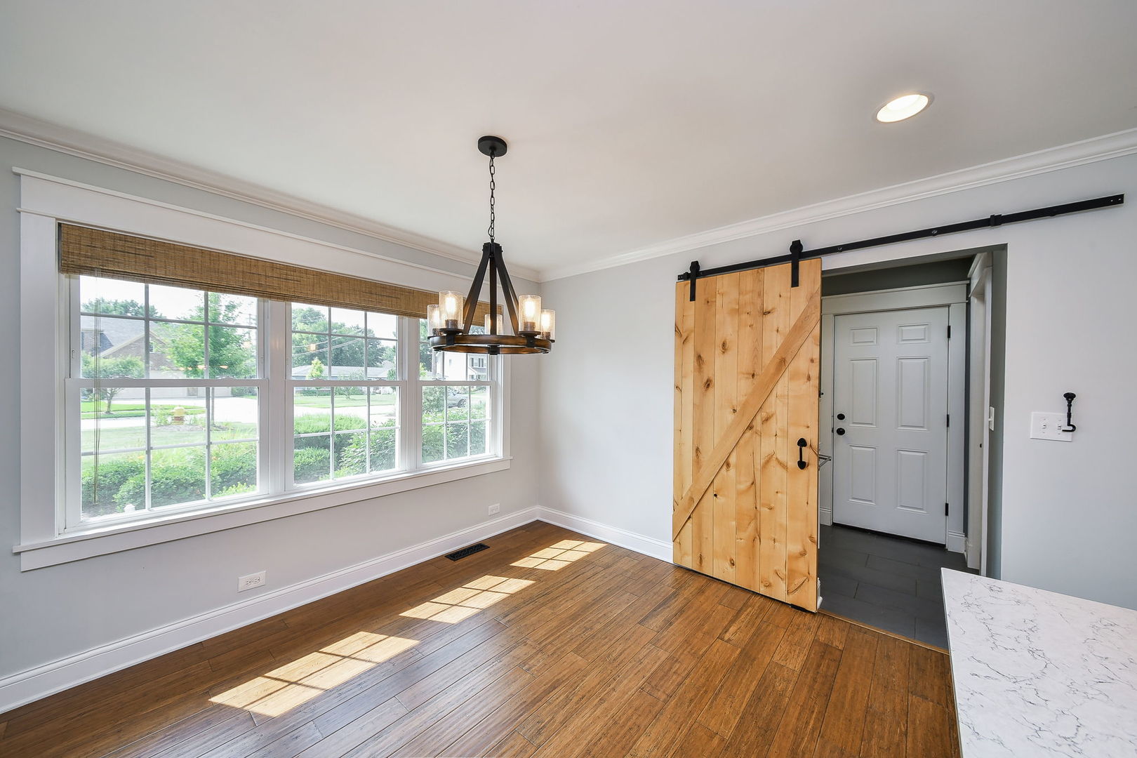 1845 Howard Street Wheaton, IL 60187 - Photo 6 of 29 a view of empty room with wooden floor and fan