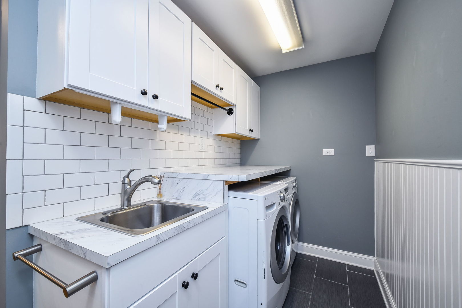 1845 Howard Street Wheaton, IL 60187 - Photo 7 of 29 a kitchen with stainless steel appliances granite countertop a sink stove and cabinets