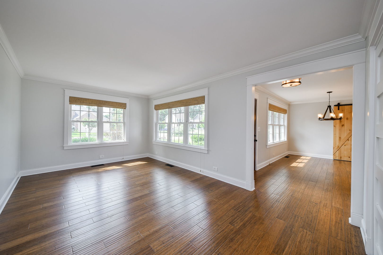 1845 Howard Street Wheaton, IL 60187 - Photo 8 of 29 a view of an empty room with wooden floor and a window