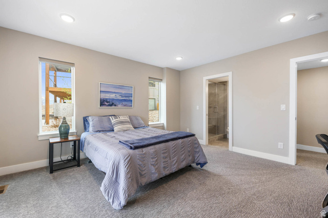 4527 North Seven Bridges Road Eden, UT 84310 - Photo 38 of 65 Bedroom with light colored carpet, ensuite bathroom, and recessed lighting