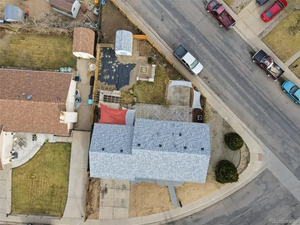 an aerial view of residential houses with outdoor space