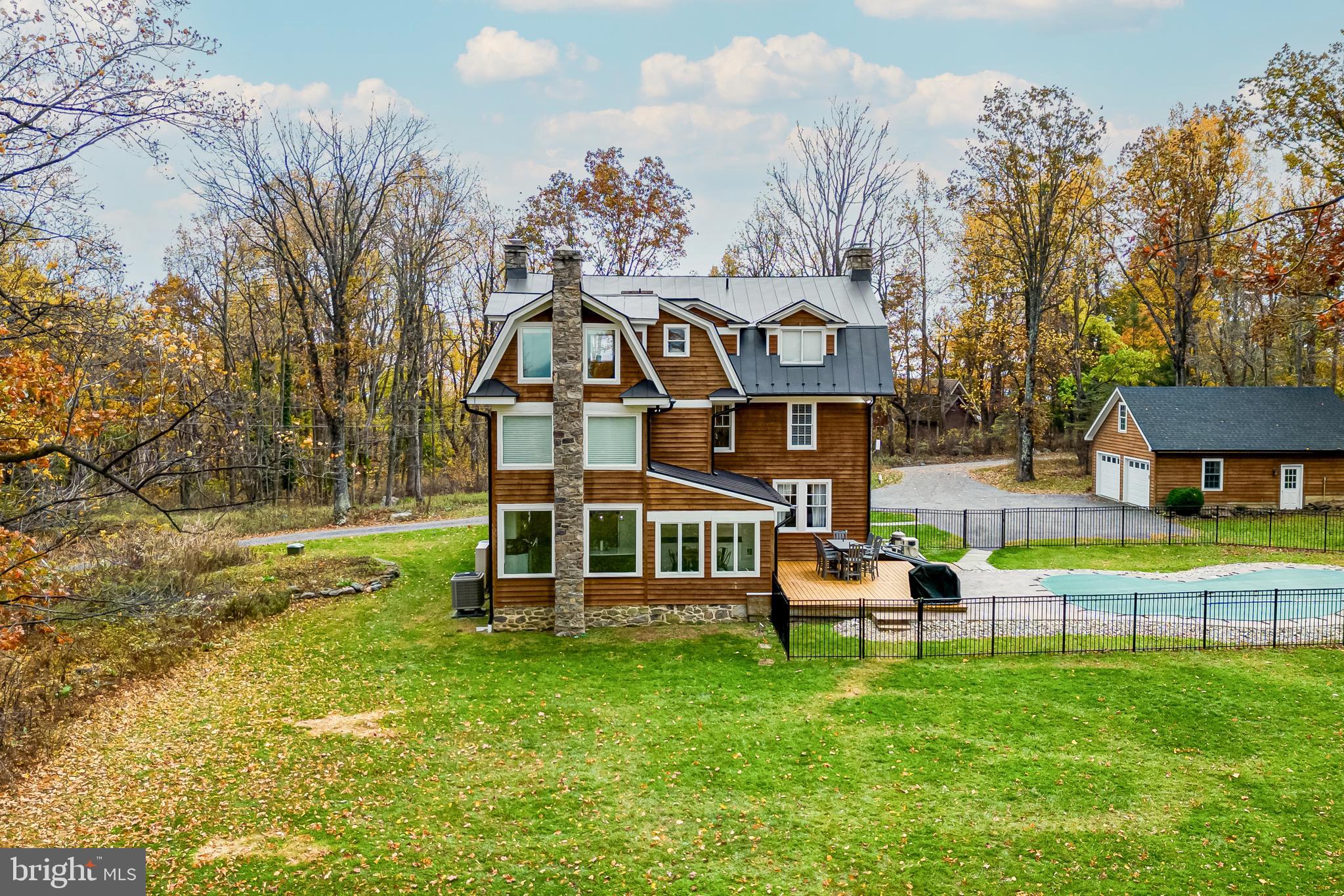 17345 Raven Rocks Road Bluemont, VA 20135 - Photo 9 of 99 a view of a house with a backyard porch and sitting area