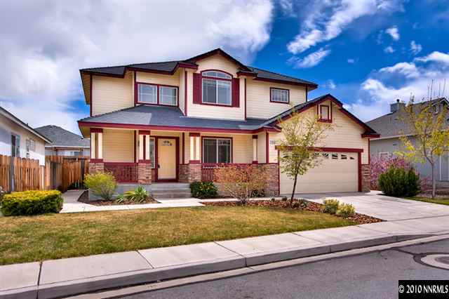 7462 Celeste Drive Reno, NV 89511 - Photo 1 of 9 a front view of a house with a yard and garage