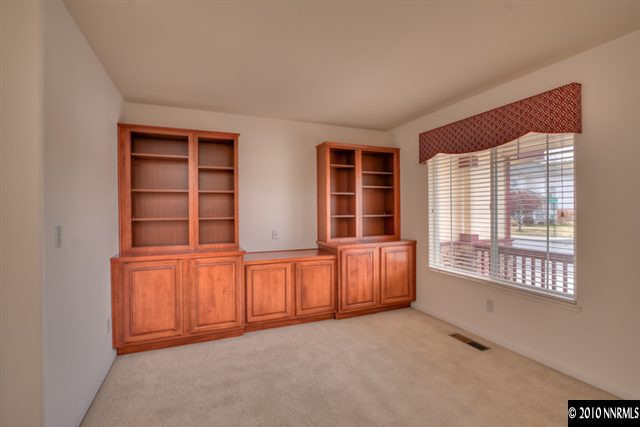7462 Celeste Drive Reno, NV 89511 - Photo 5 of 9 an empty room with windows