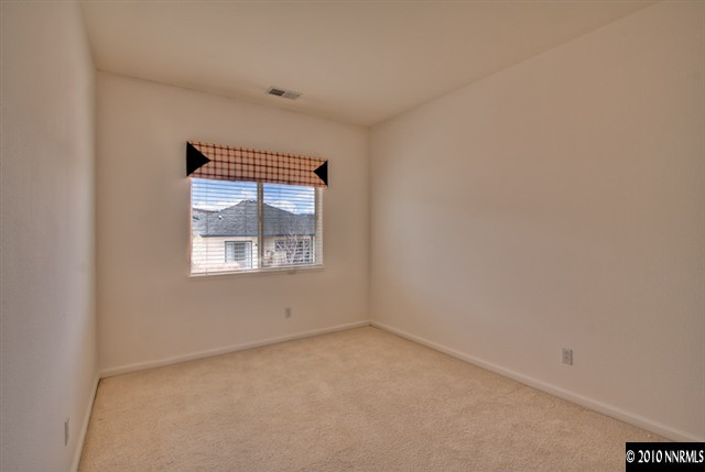 7462 Celeste Drive Reno, NV 89511 - Photo 8 of 9 an empty room with a window