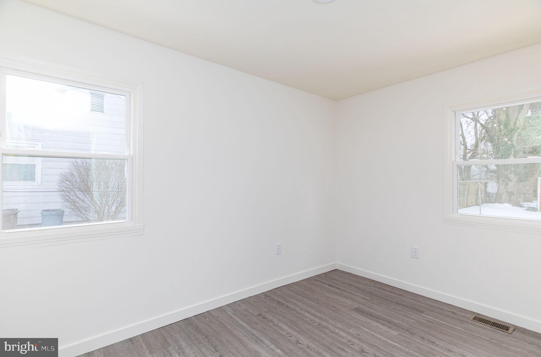 8 South Reed Street Bel Air, MD 21014 - Photo 13 of 21 an empty room with wooden floor and windows