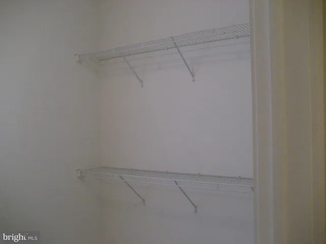 a view of a room with racks on the wall