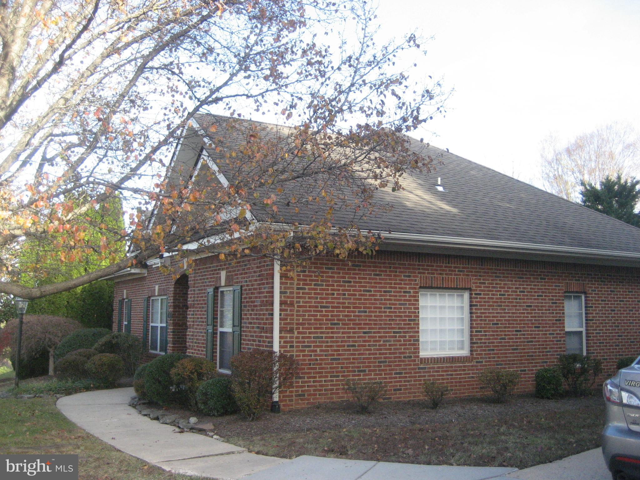180 Carriage Chase Circle Warrenton, VA 20186 - Photo 2 of 22 a front view of a house with garden