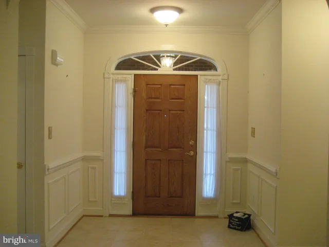 a view of a hallway with wooden door